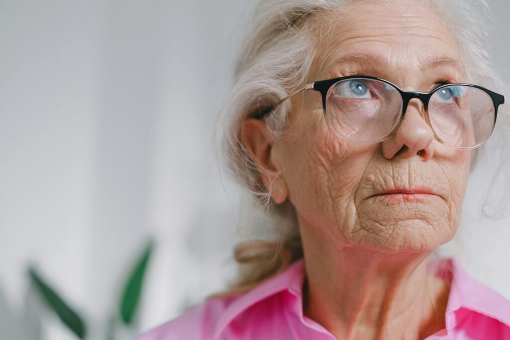 Close-up portrait of a thoughtful elderly woman symptoms or swallowing disorders